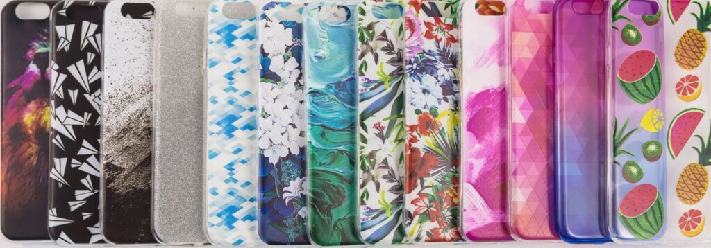 A vibrant collection of variously patterned iPhone cases arranged on a white surface.